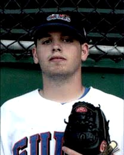 Ryan Moorer in his minor league uniform, glove raised in front of his chest